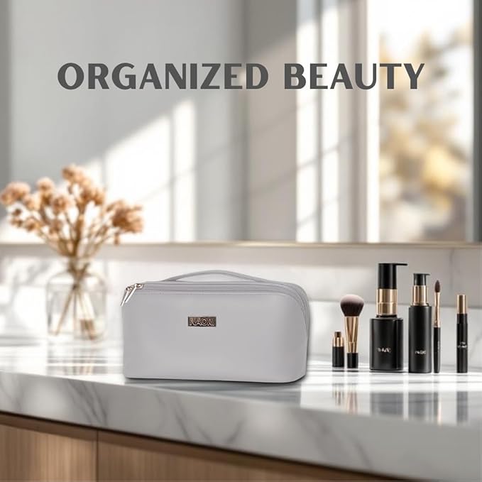 NAORI Travel Makeup Bag for Women | Large Luxury Cosmetic Organizer with Handle & Inner Pockets | Waterproof Faux Leather Toiletry Bag | Makeup Case for Home, Travel & Gifting (Soft Grey)