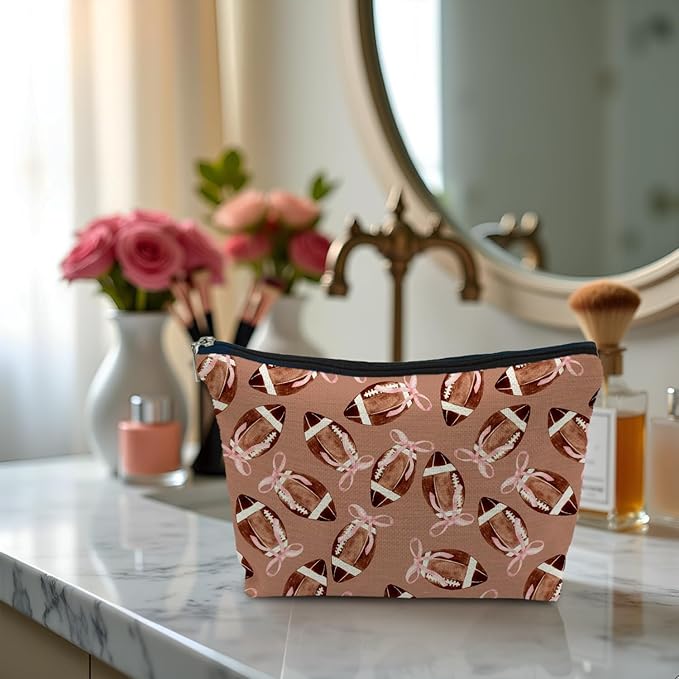 SAFDSGFDB Coquette Pink Bow Football Makeup Bag, Football Lovers Gifts Cosmetic Bags for Women, Sports Player Fan Gifts Portable Travel Toiletry Bag Zipper Makeup Pouch